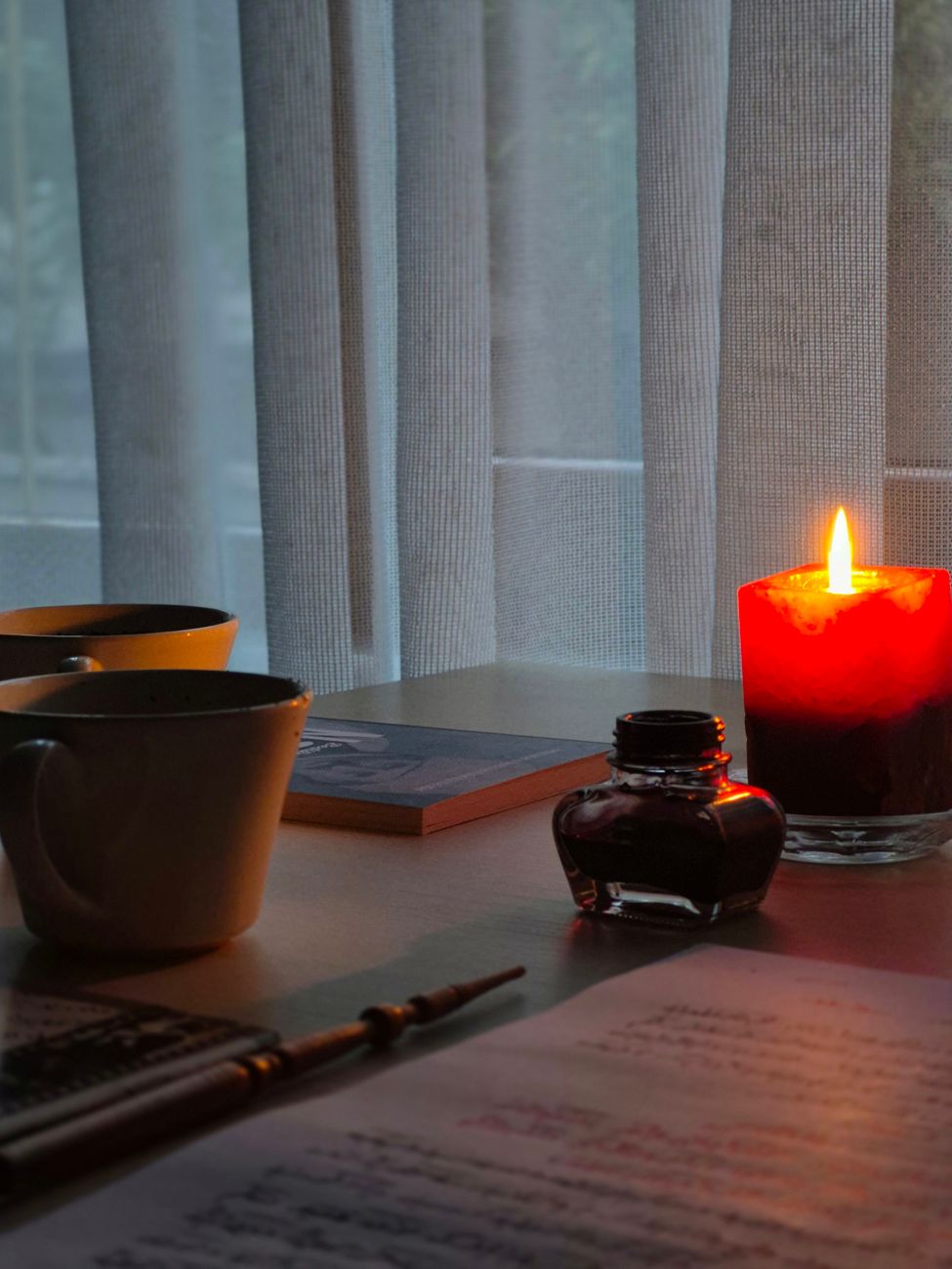 Travel writer reviewing notes beside open window